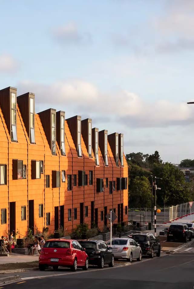 Looking down the road, the faced of the terraces look a deep orange in the late afternoon sun. 