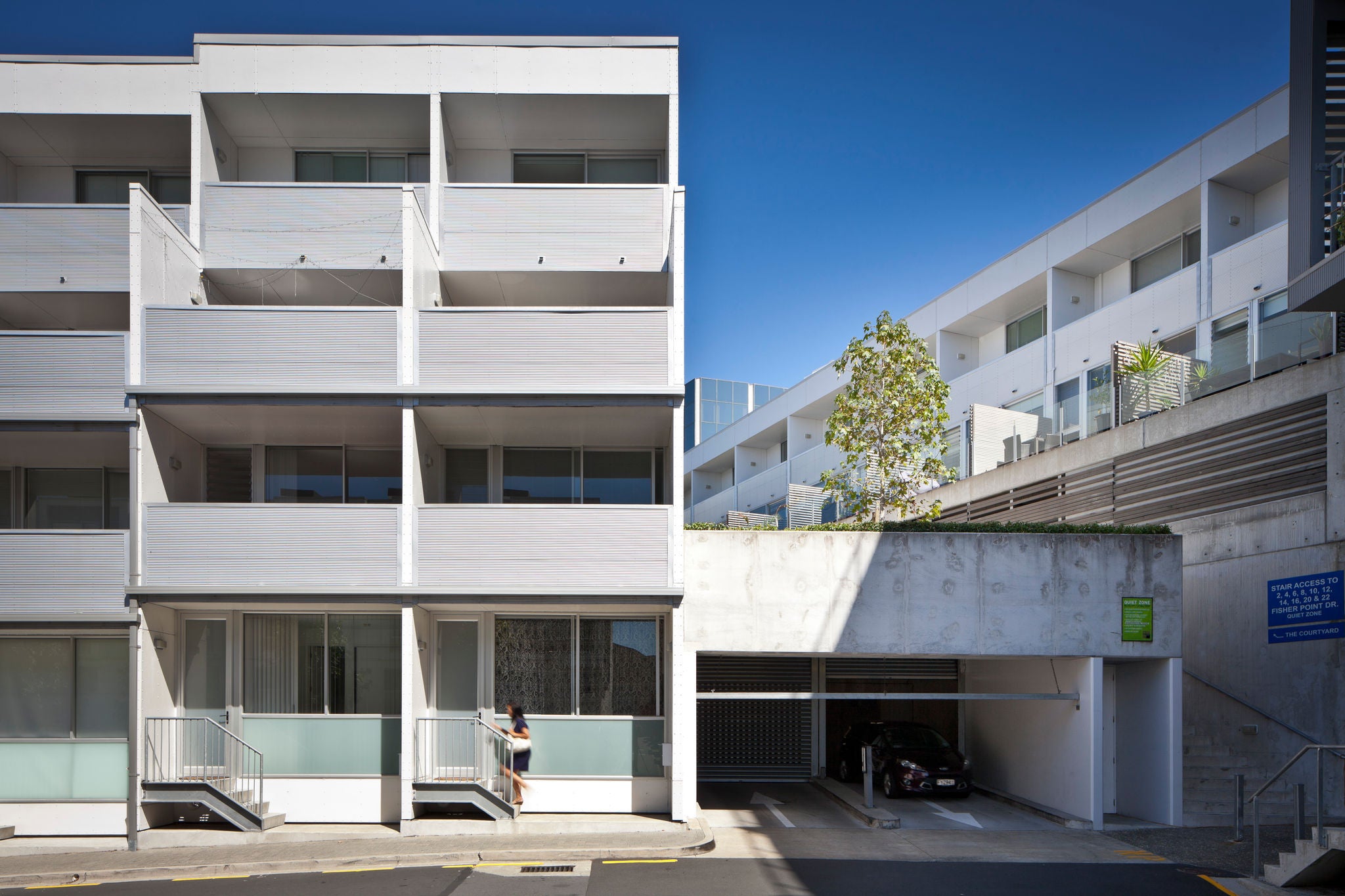 Looking from across the street at the parking garage entrance.