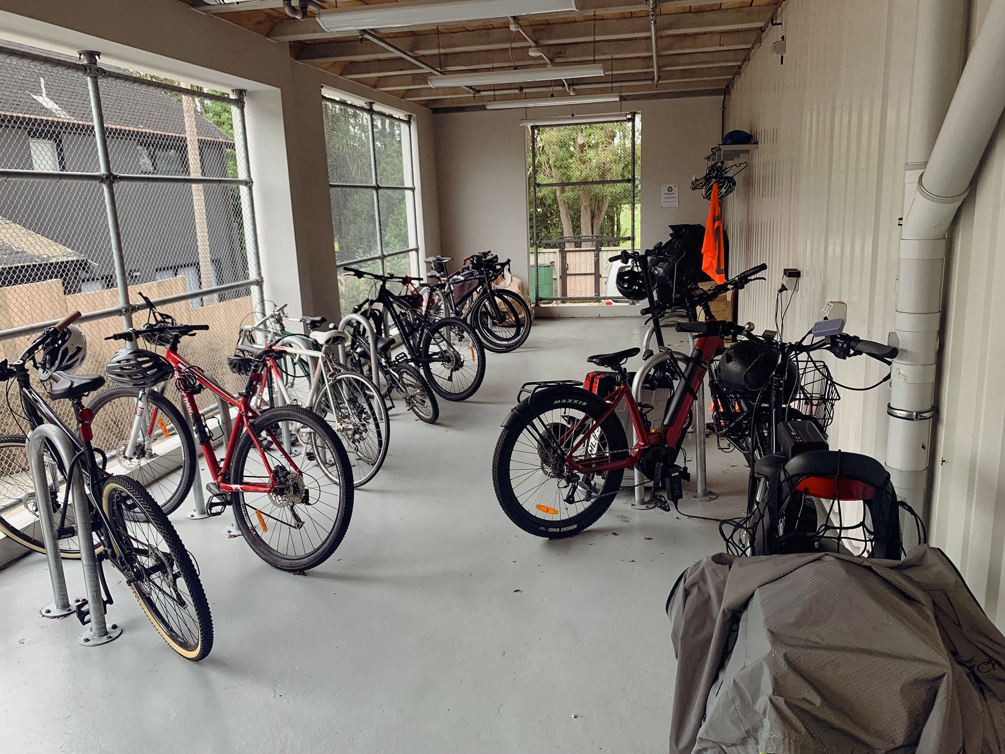 Various bikes parked in the especially designed bike parking space.