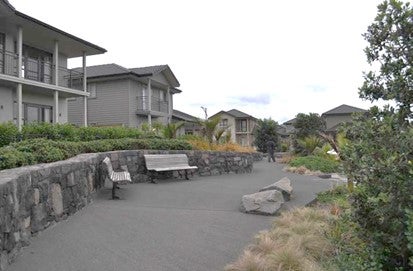 Generous path in new subdivision working with natural contours of the land.