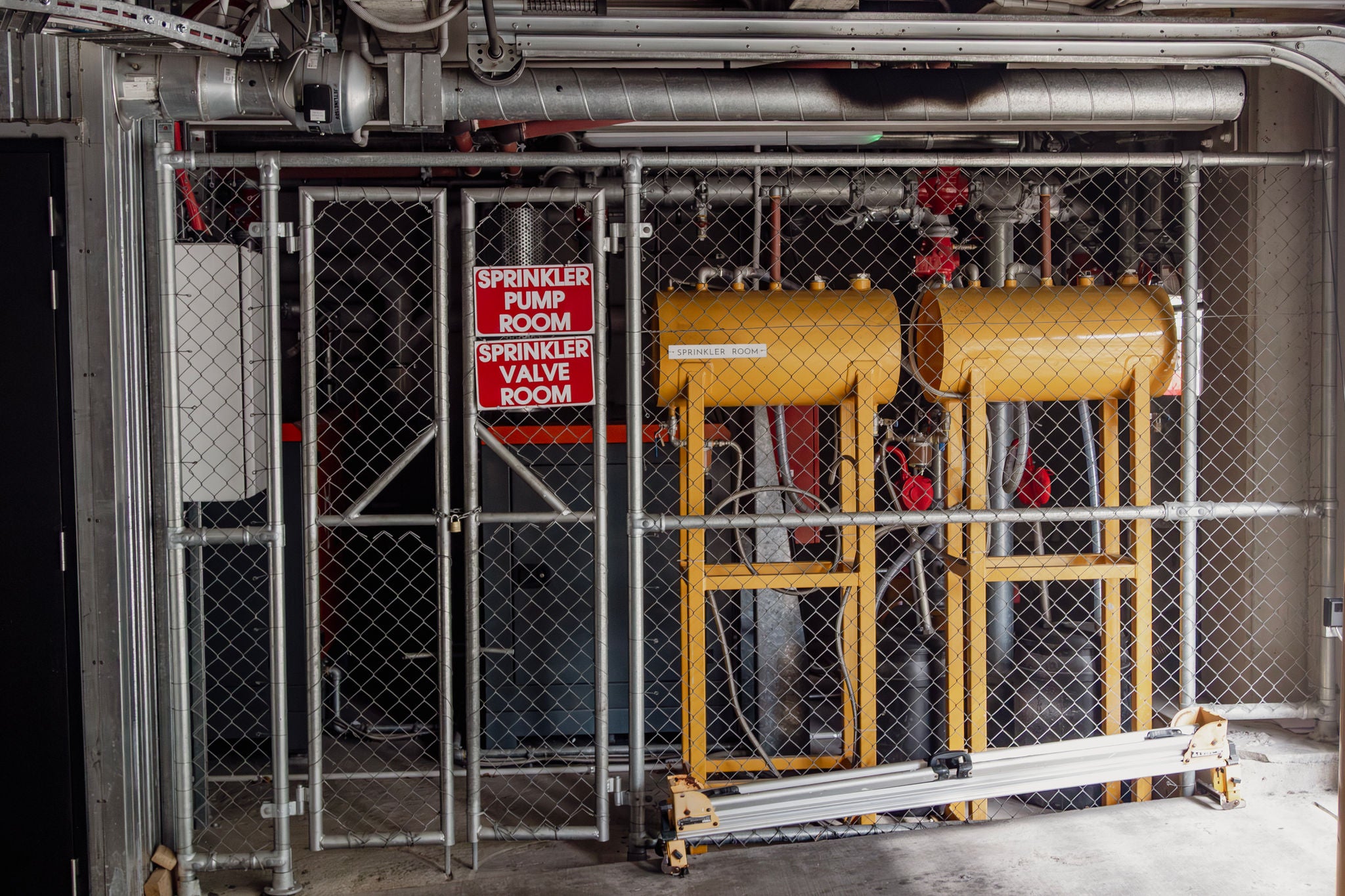 Sprinkler  pump room near the front garage entrance way.