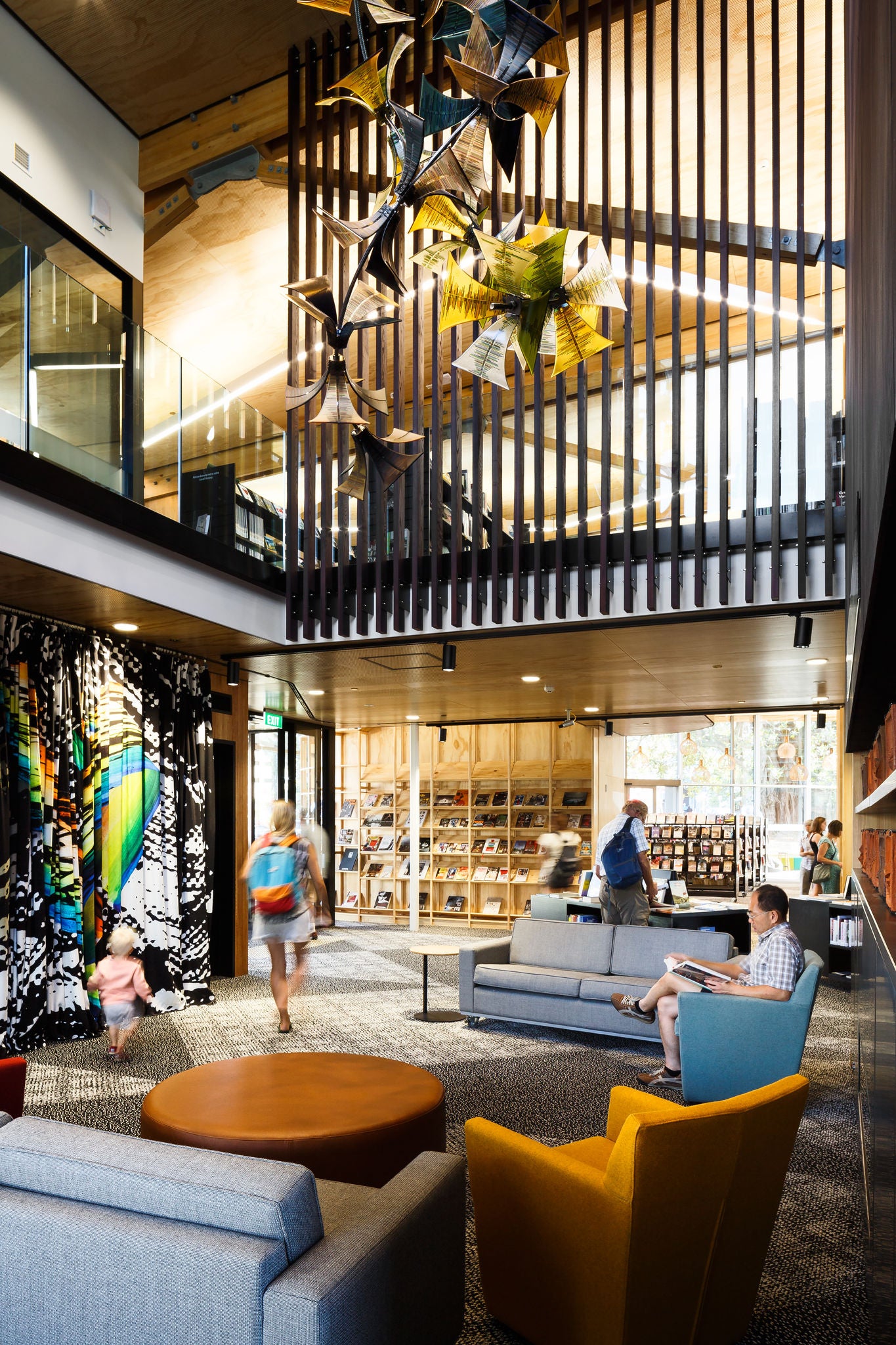 All ages of  visitors enjoying the inside of the Devonport library.