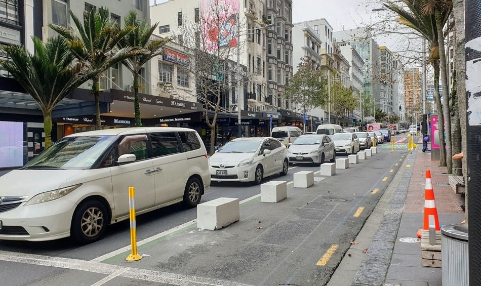 'Sugar cube' concrete blocks marking the extended footpath edge on Queen Street. 