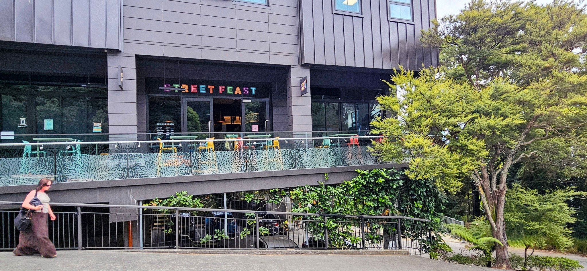 Side profile photo with colour and outdoor tables and chairs.