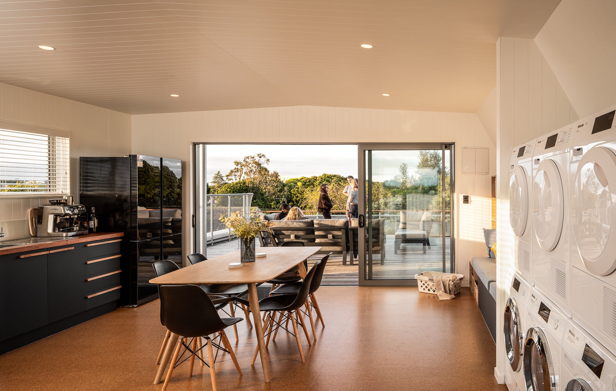 Interior on the top floor of the building in the shared laundry facilities as well as kitchen and dining.