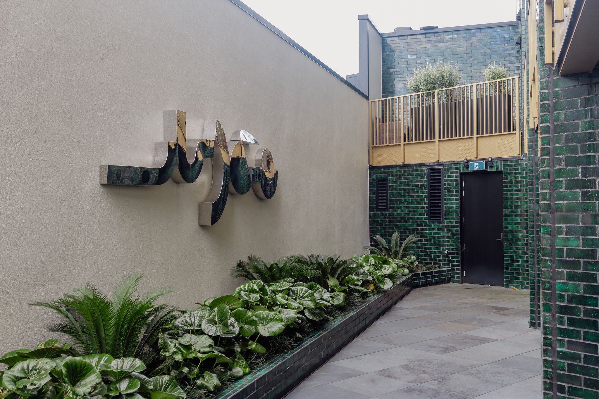 Lovely exterior garden and seating area outside of the office on the 1st floor.