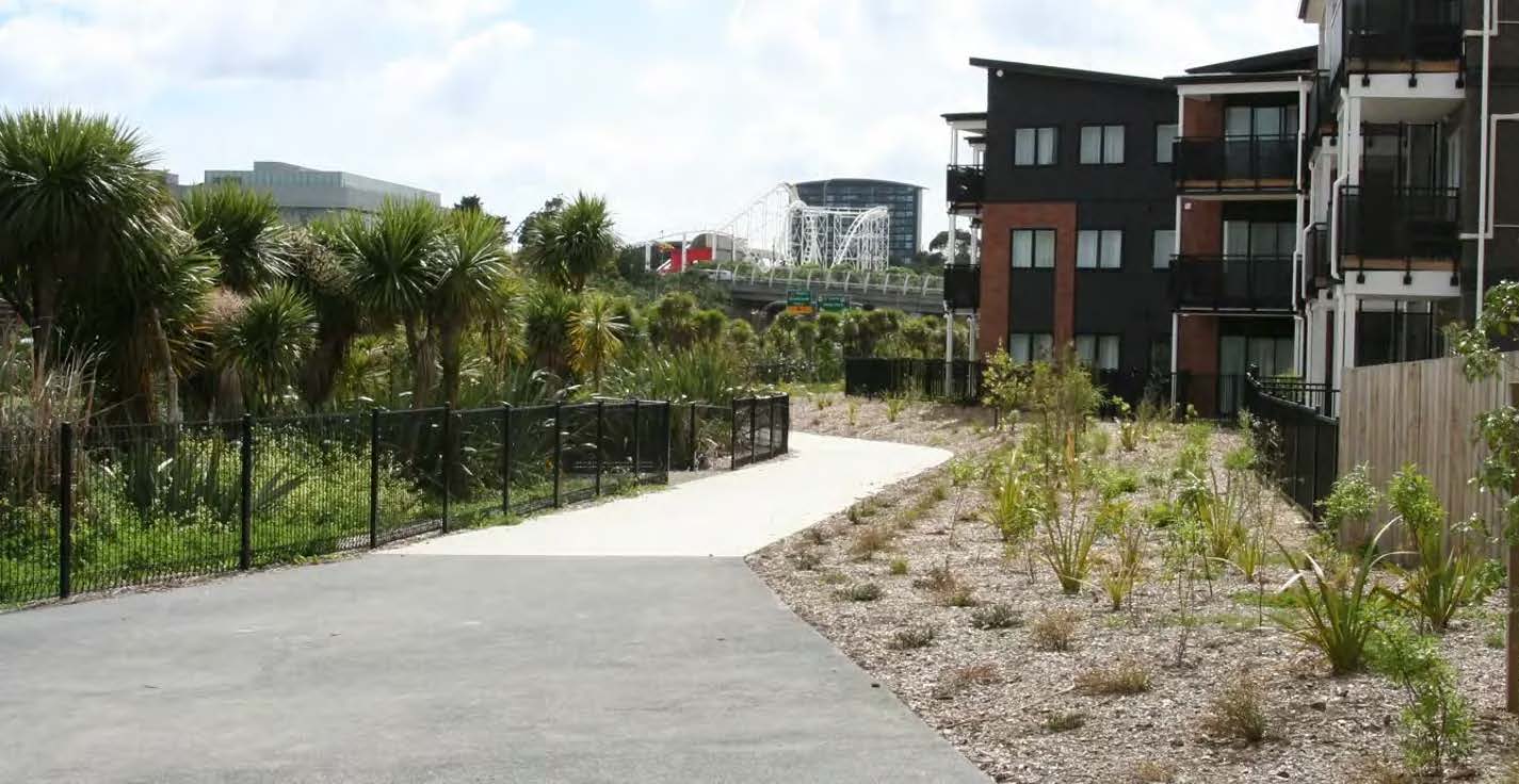 Looking down the path, the homes are on the right, and Rainbow's end is in the distance.