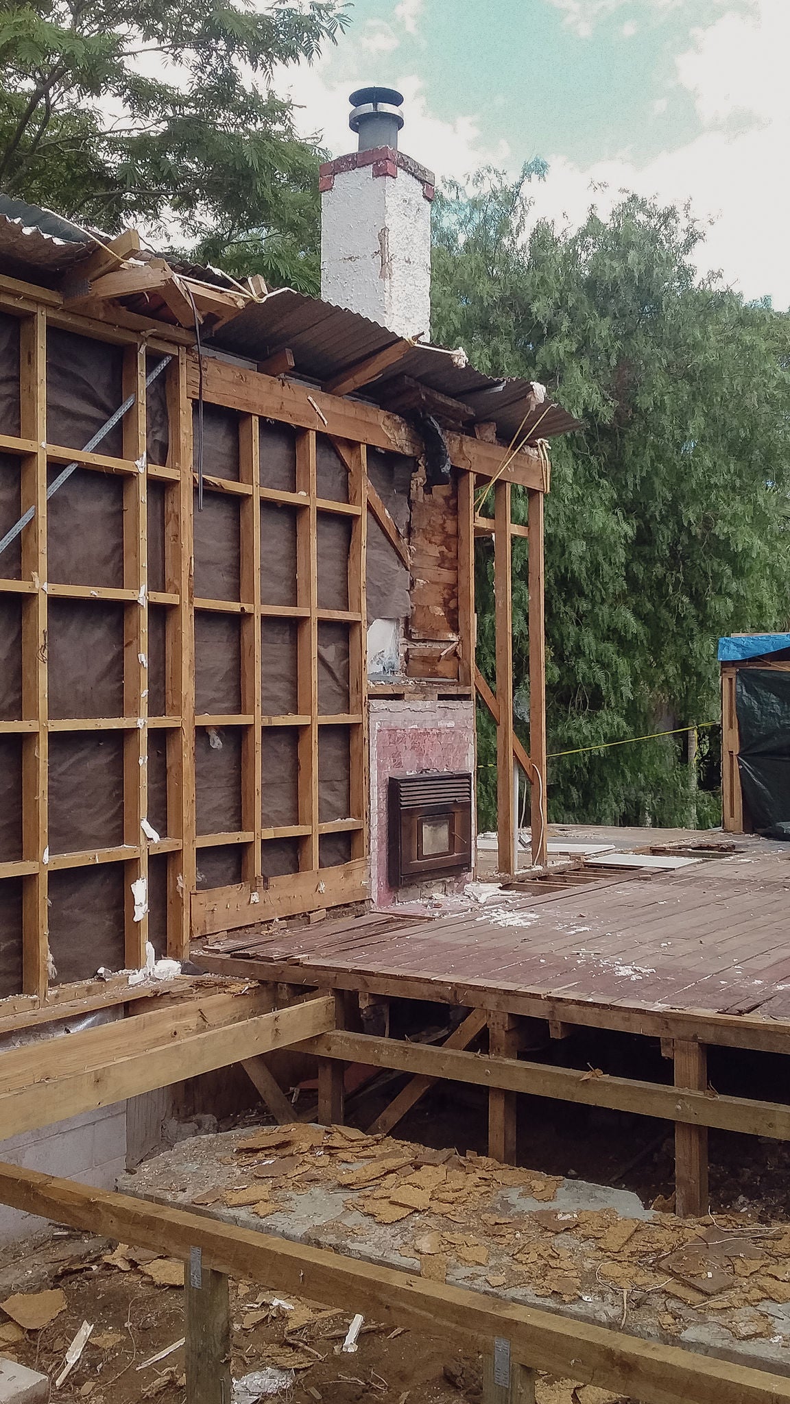 The old bungalow chimney being demolished.