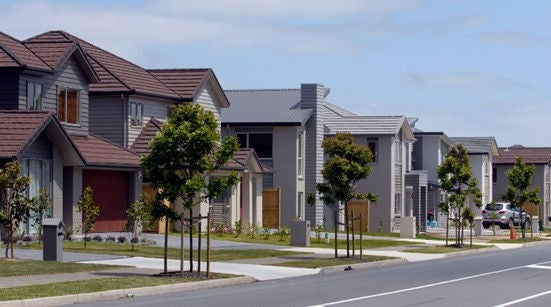 Vehicle crossings that maintain the level of the footpath promote walkable neighbourhoods. Image credit: Michael Craig for NZ Herald.