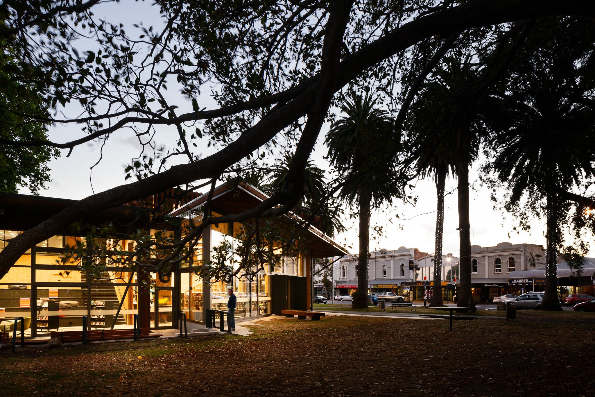 The Devonport Library  at night view from the park outside with the main street in the distance. Image: Jason Mann