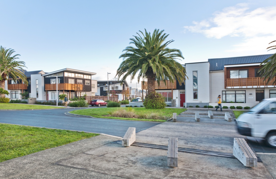 Buckley avenue is lined with modern terraces and pam trees.