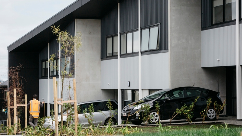 Two storey terraced dwellings with central courtyard area in front, that are part of an urban papakāinga located on Kupe Street, Ōrākei, Auckland, ancestral whenua of Ngāti Whātua Ōrākei.  